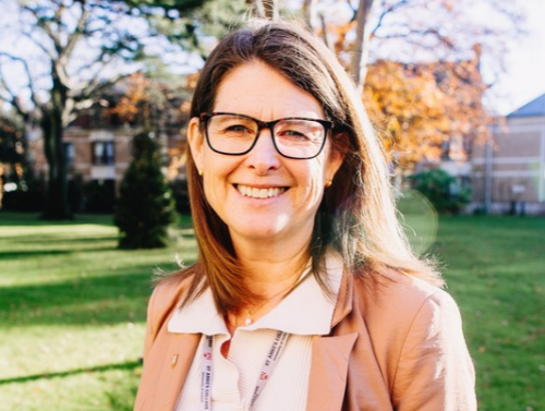 Helen King, Principal of St Anne's College, stands in the college grounds